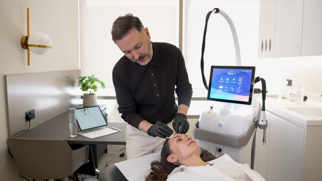 Dr Paul Elgey treating a patient with UltraClear laser
